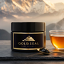 Gold Seal Shilajit resin jar with herbal tea and mountain backdrop